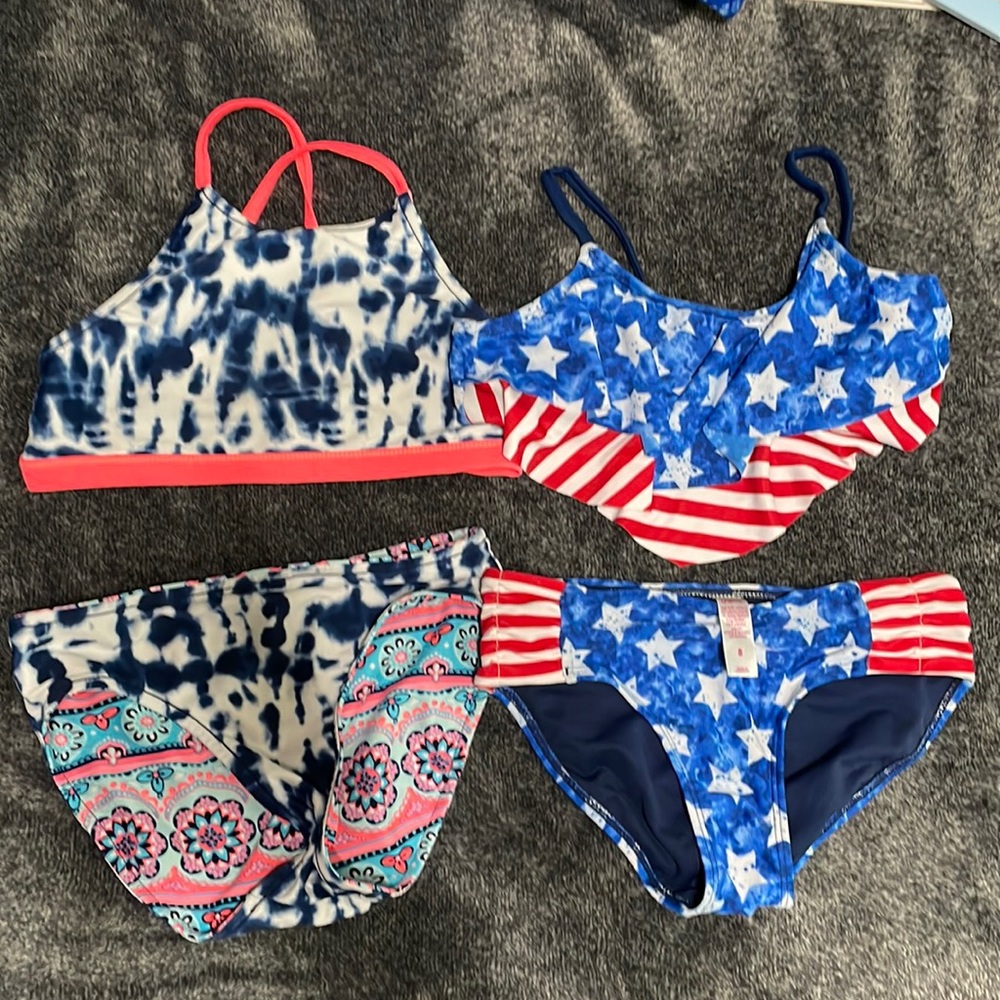 Girls Justice bathing suits. Star one elastic worn.